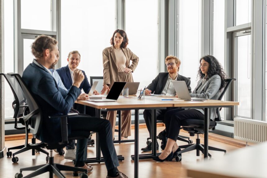 A,Group,Of,Business,Professionals,Are,Having,A,Meeting,In